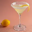 Firefly Un cocktail lemon drop dans un verre à Martini. Il y a du sucre sur le rebord de la coupe et (3).webp